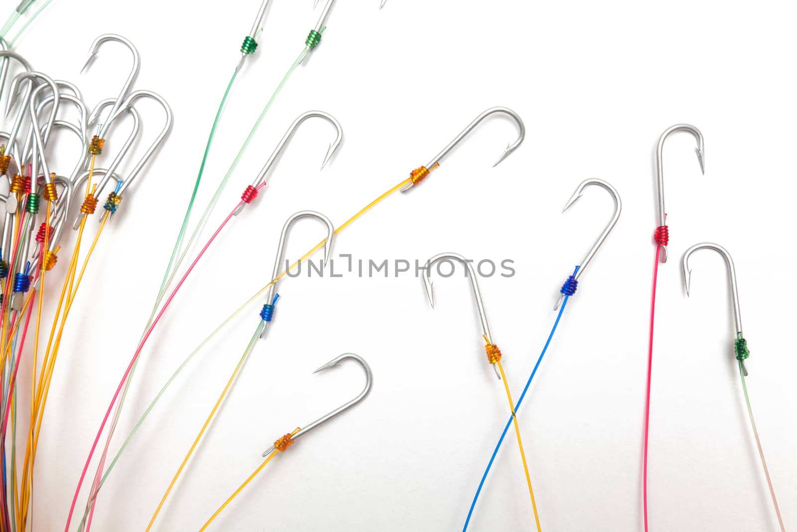 A fishing hooks tied with fishing line, isolated against a white background