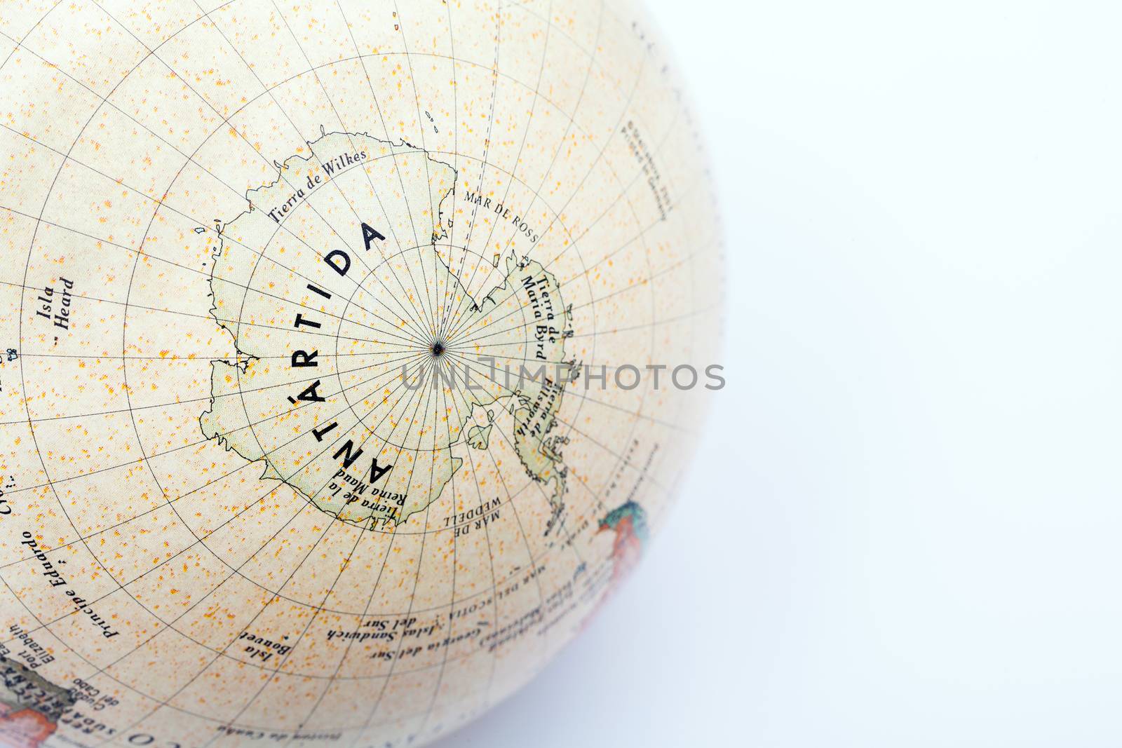 Part of a globe with map of South Pole isolated on white background