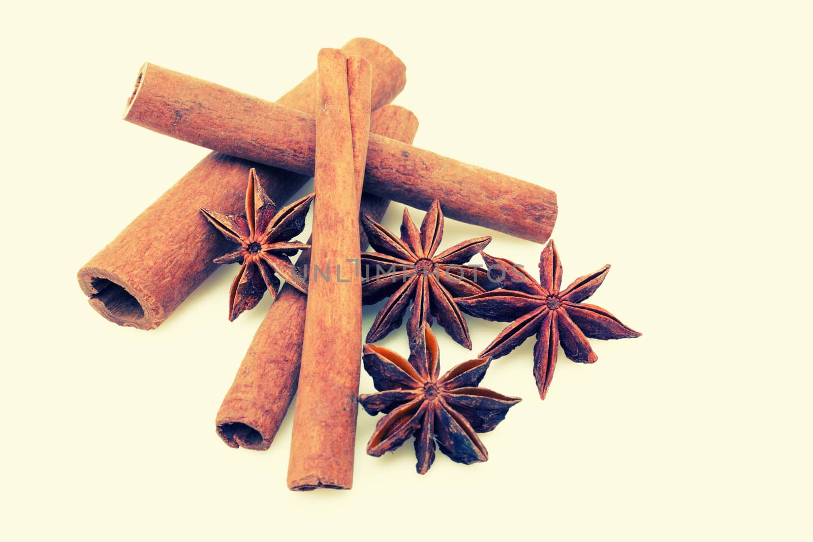 Star anise with cinnamon sticks isolated on white