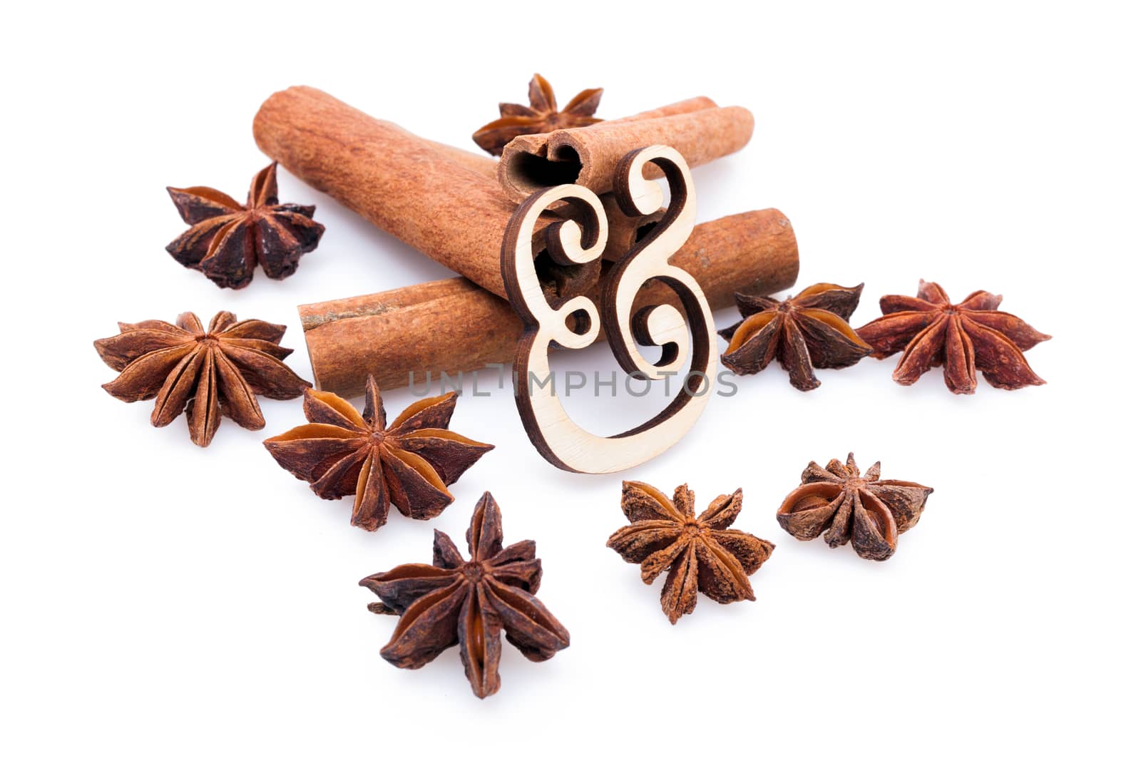 Star anise with cinnamon sticks isolated on white