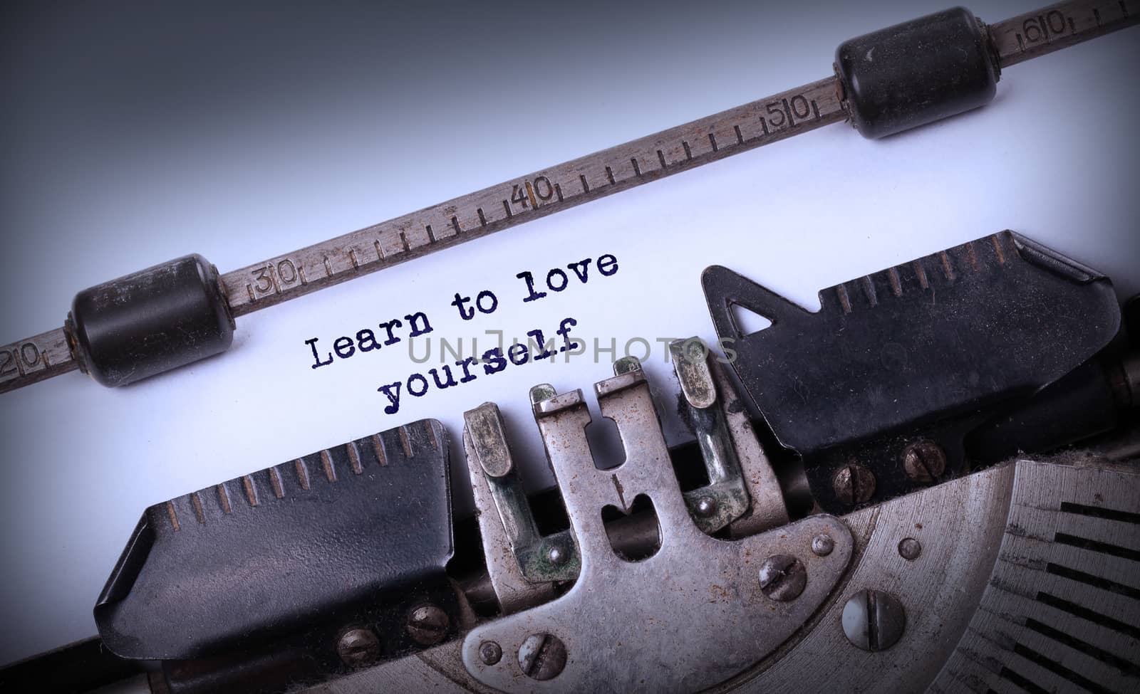 Vintage inscription made by old typewriter, Learn to love yourself
