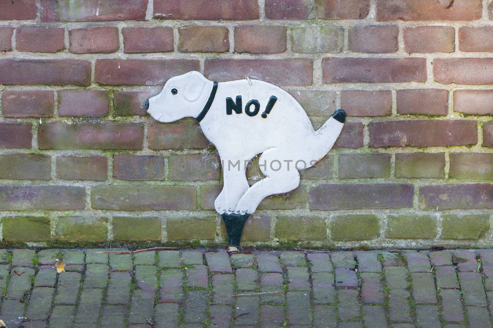 Sign prohibiting dogs to take a dump, street in the Netherlands