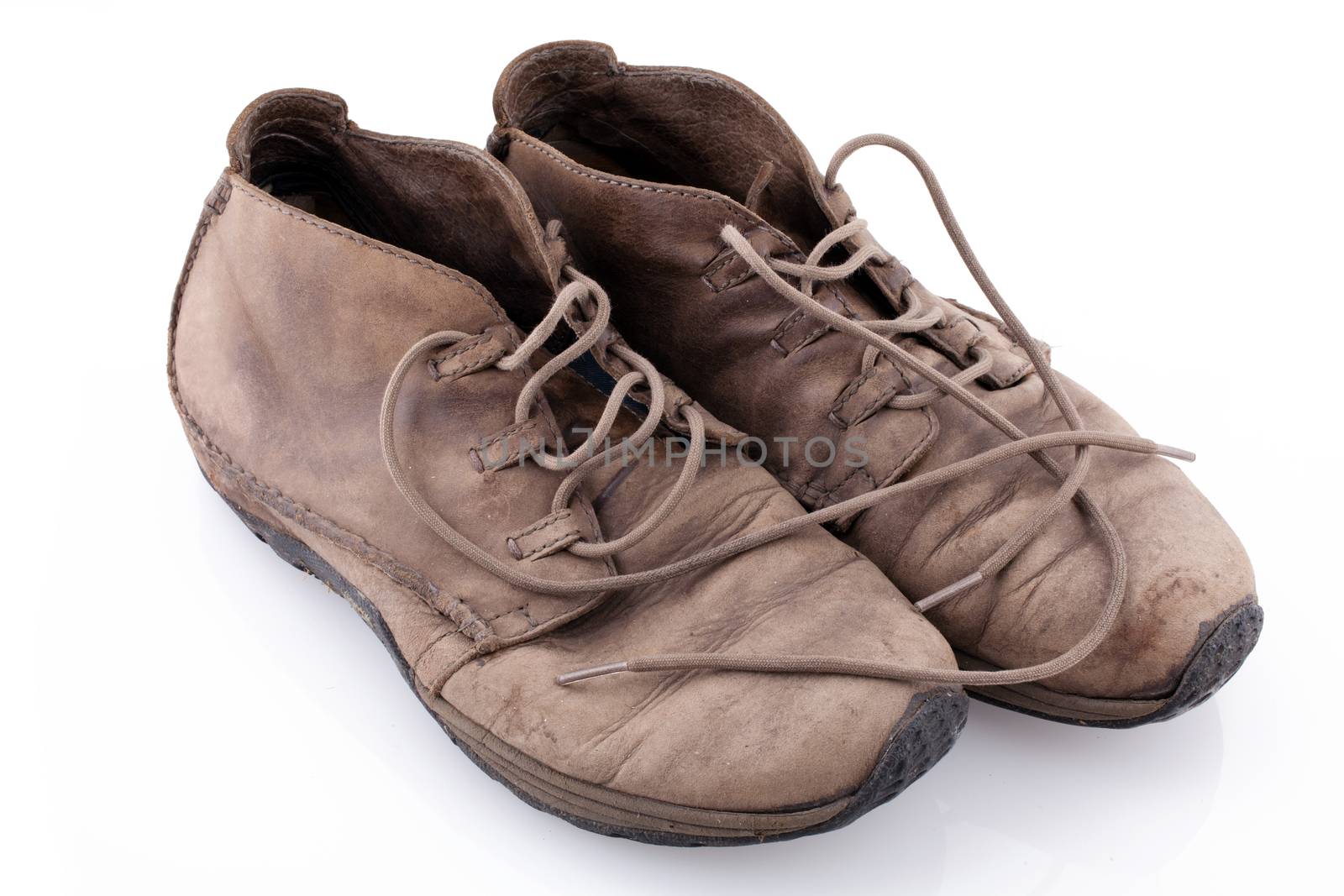 Pair of old leather boots isolated on the white background