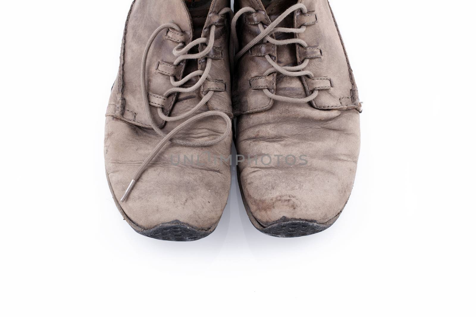 Old shoes isolated on white background by Portokalis