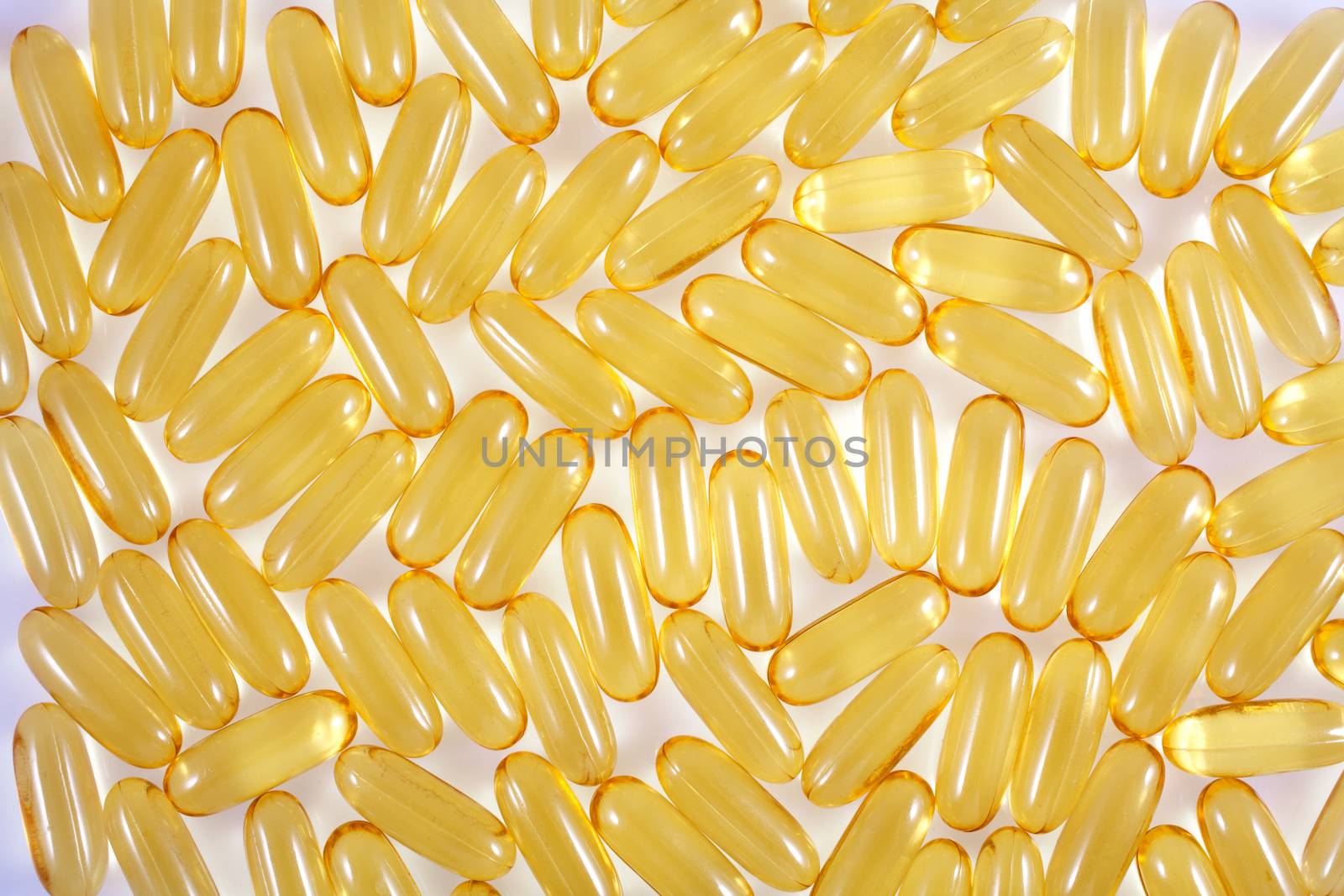 Oil vitamins capsule shapes on white background