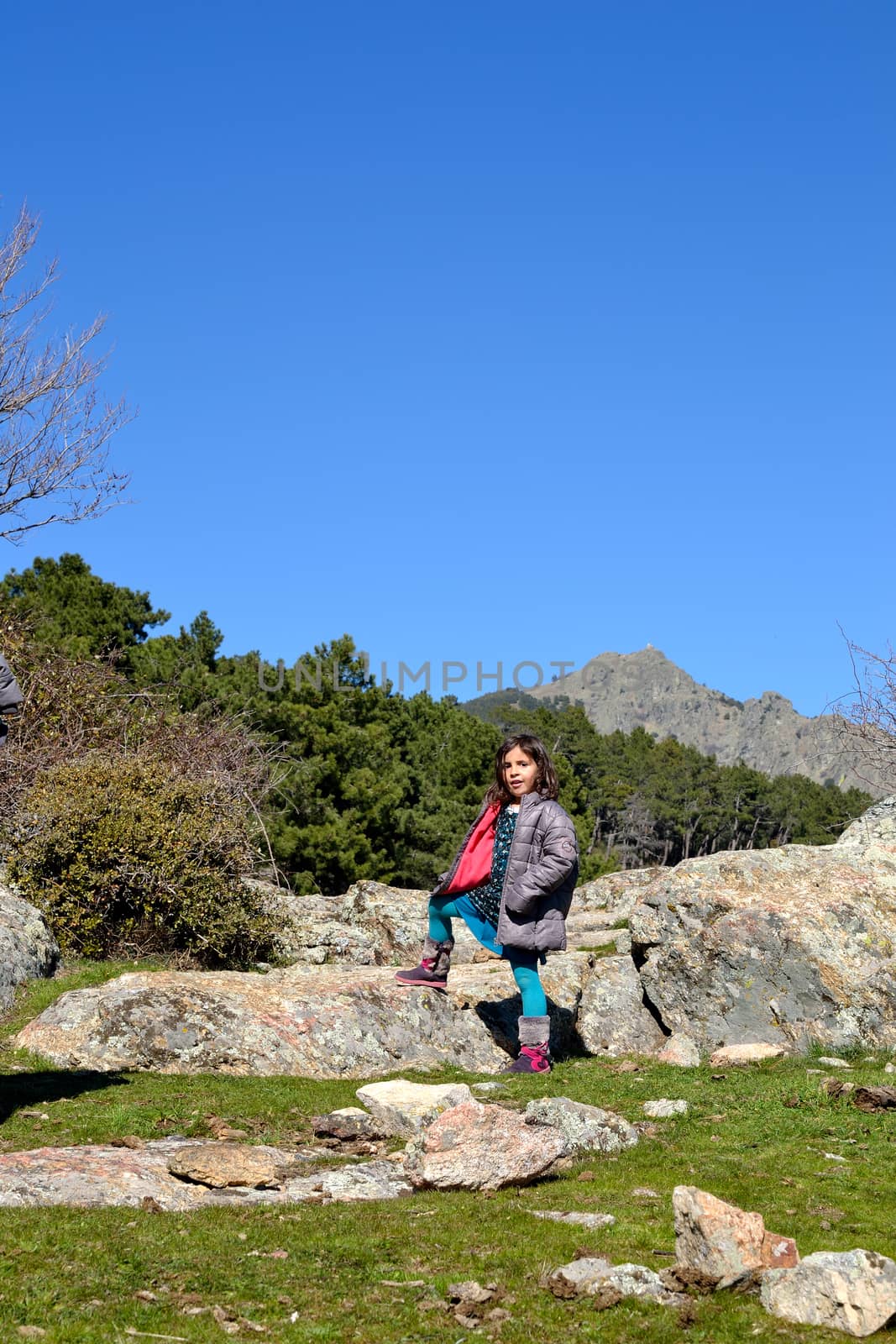 little girl in the mountain. San Lorenzo del Escorial, bosque del Cerrado, Spain.