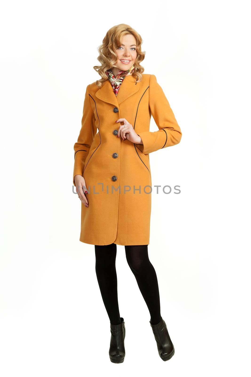 The girl in a yellow autumn coat on a white background