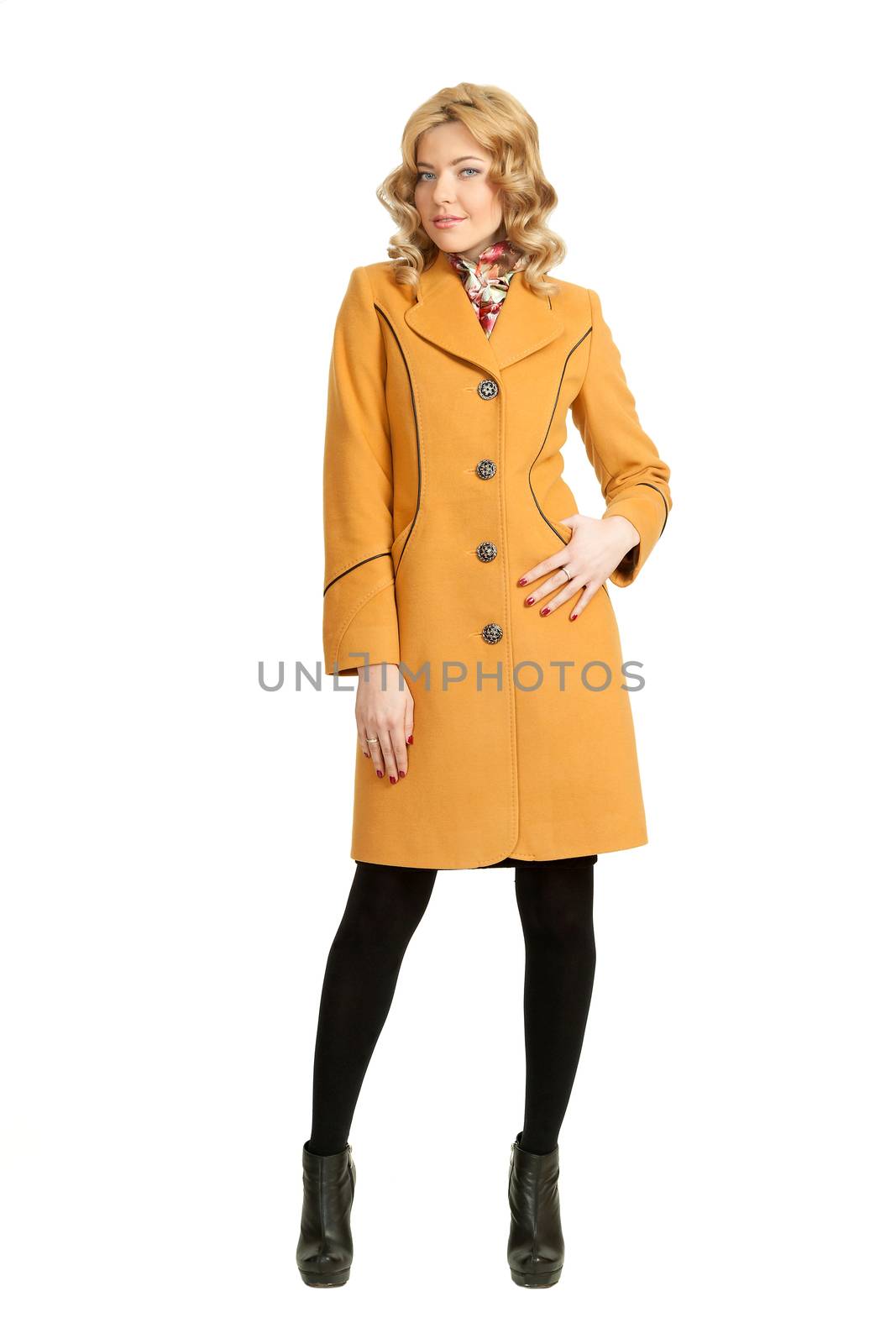 The girl in a yellow autumn coat on a white background