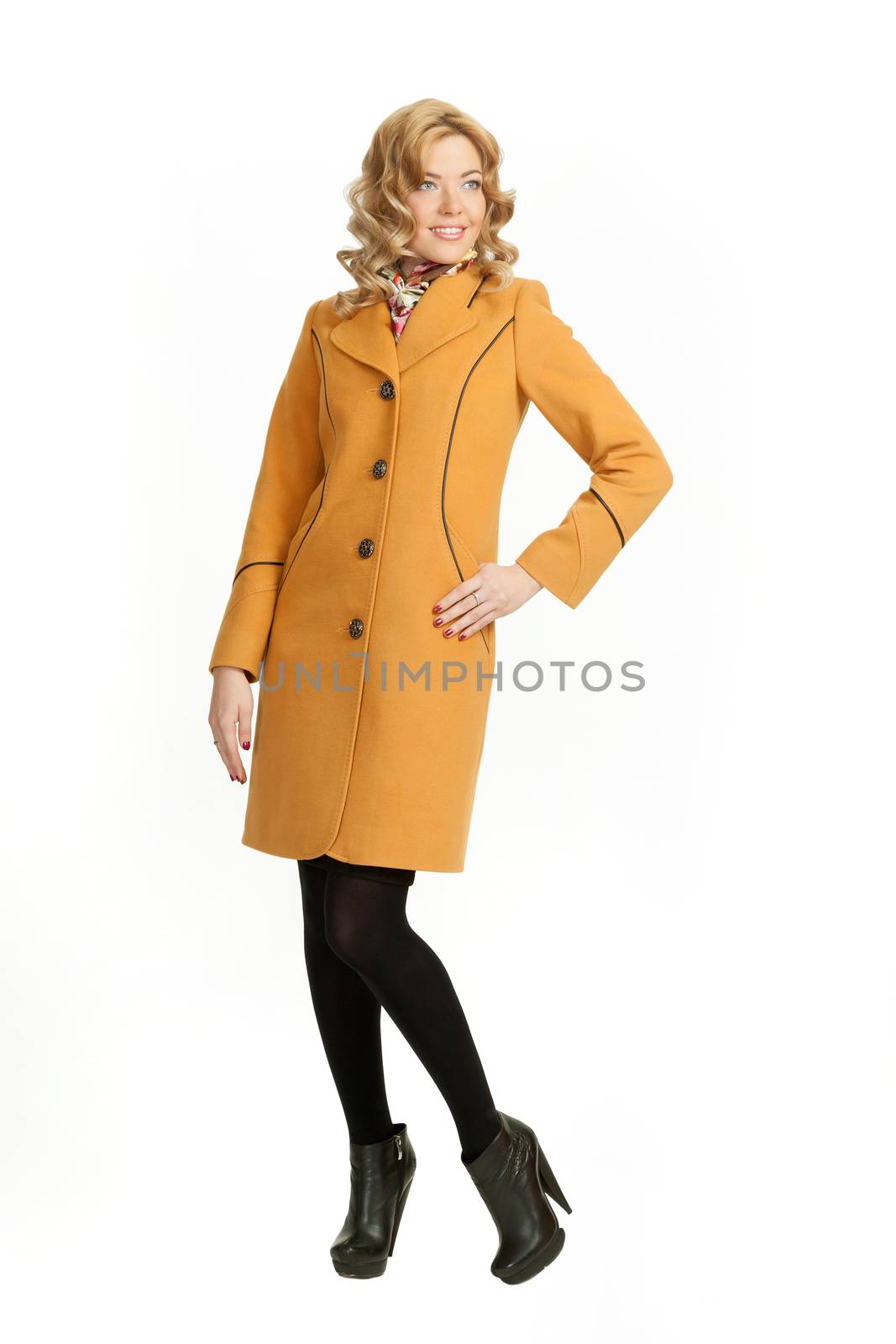 The girl in a yellow autumn coat on a white background