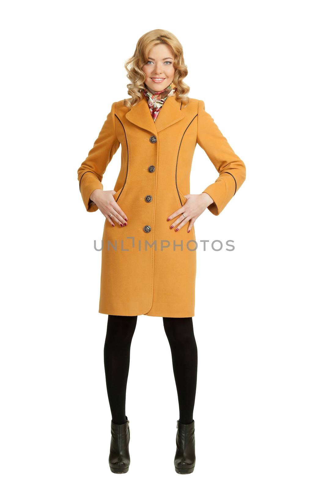 The girl in a yellow autumn coat on a white background