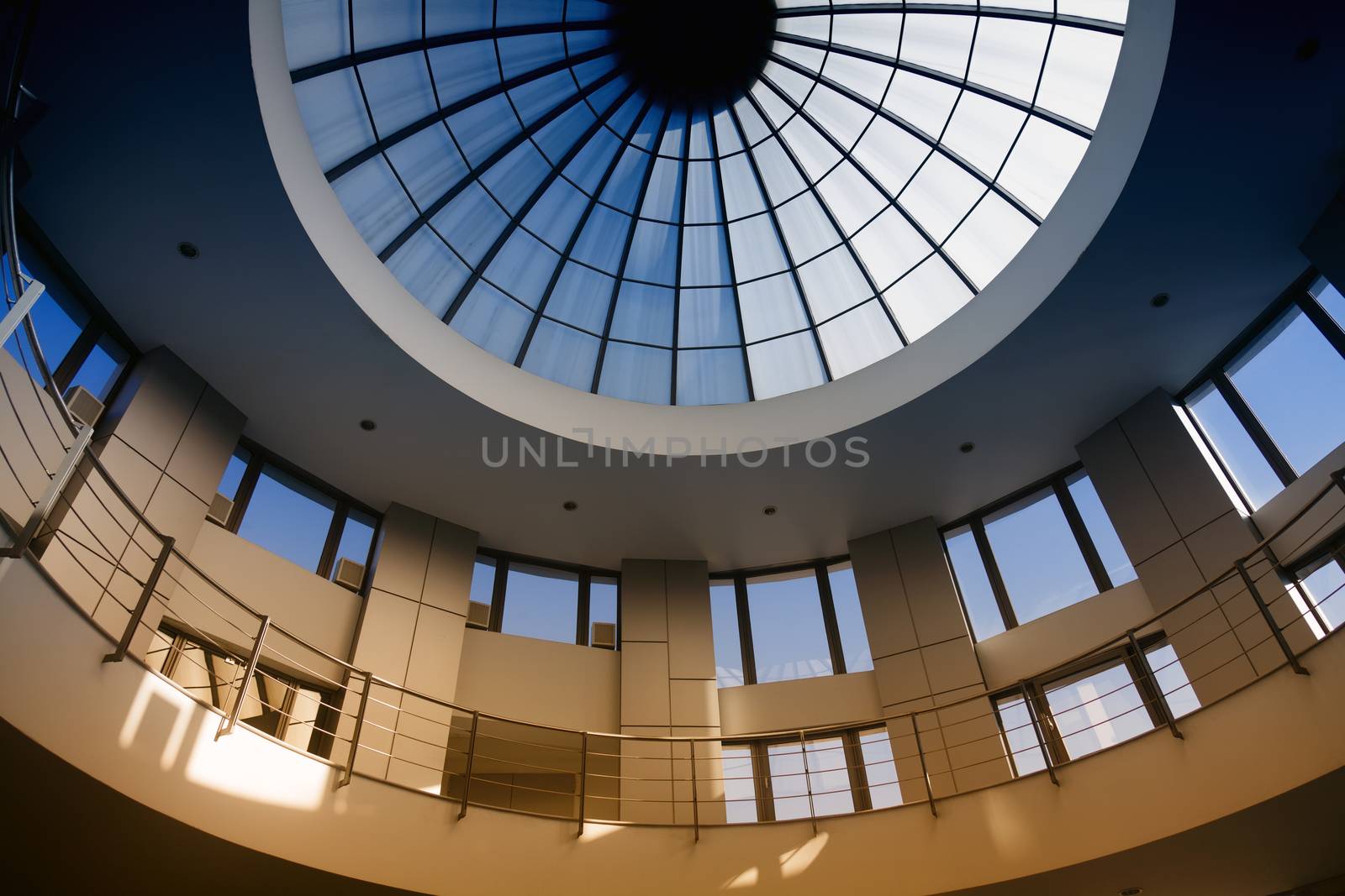 Interior of a circular modern building with glass dome