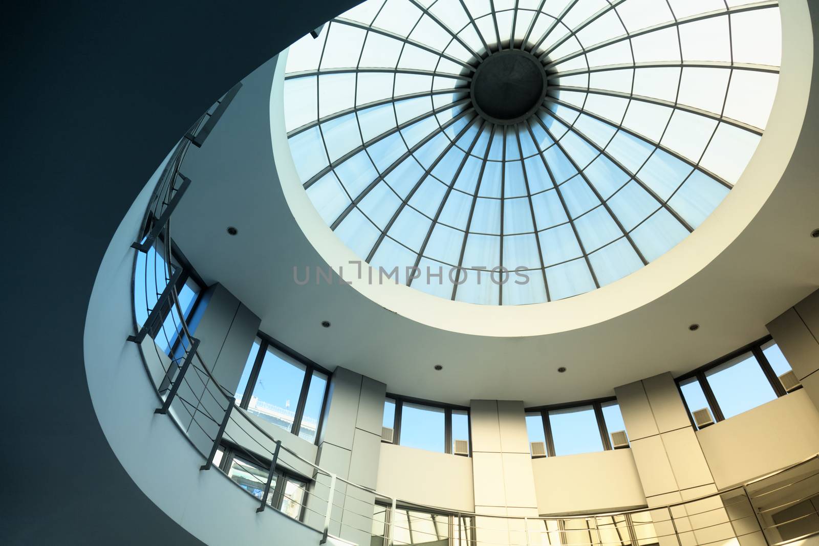 Interior of a circular modern building with glass dome