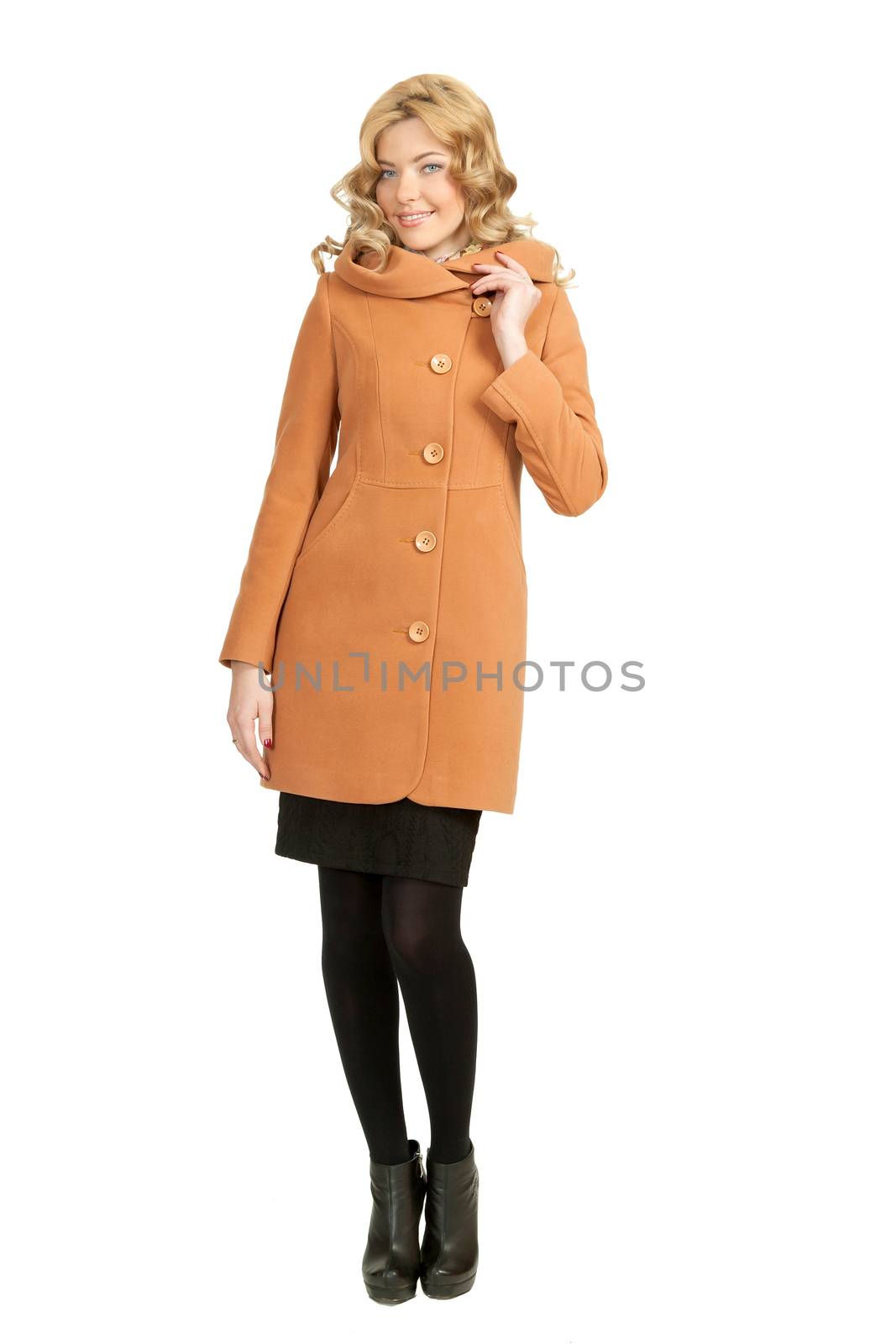 The girl in a yellow autumn coat on a white background