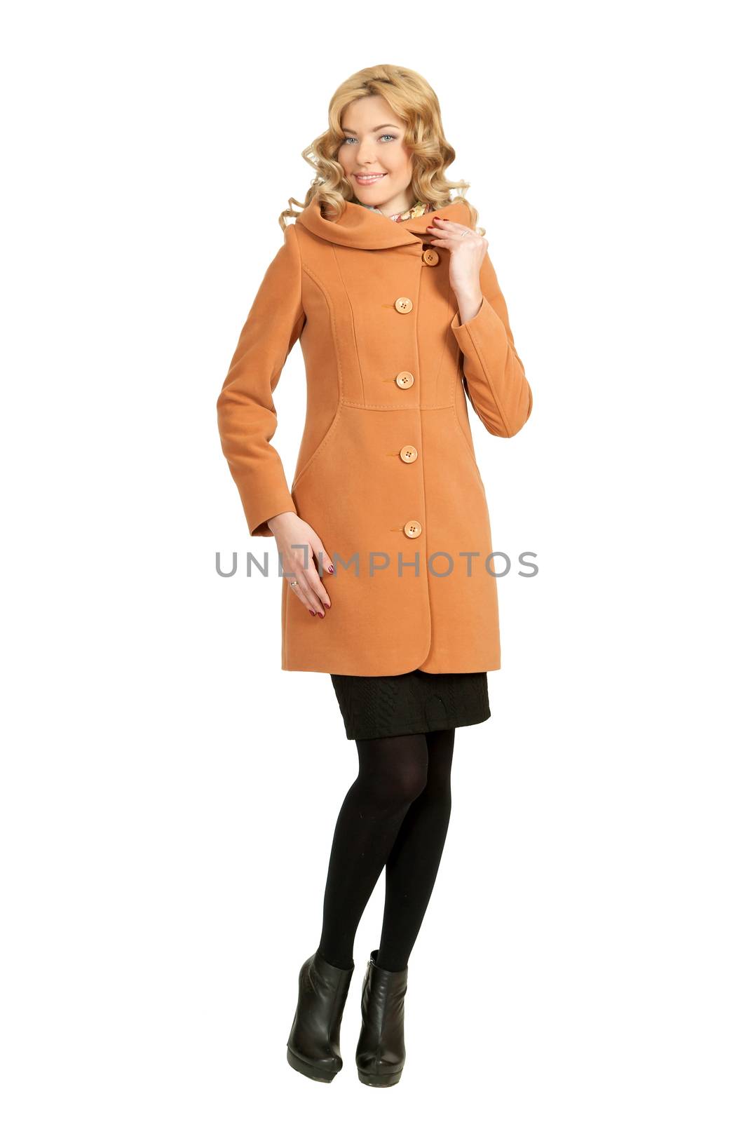 The girl in a yellow autumn coat on a white background