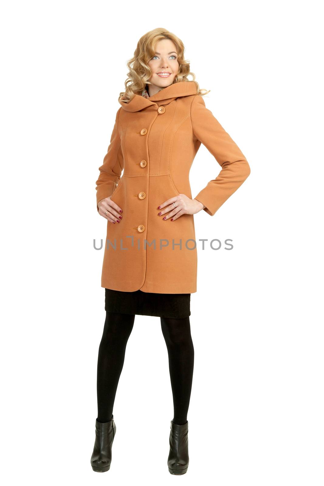 The girl in a yellow autumn coat on a white background