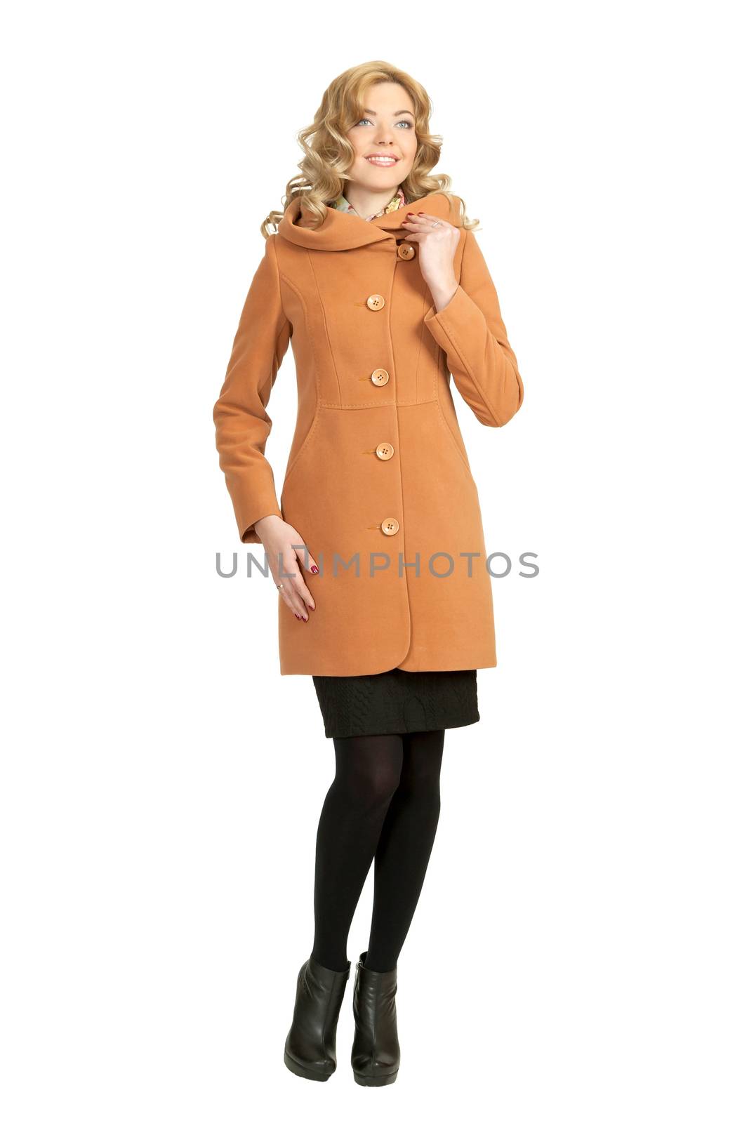 The girl in a yellow autumn coat on a white background