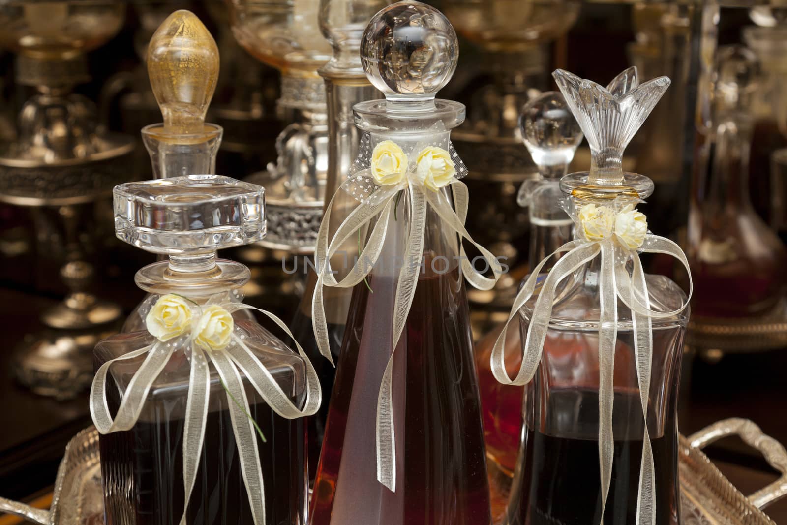 Decorated wedding bottles of homemade drink (cognac or brandy)