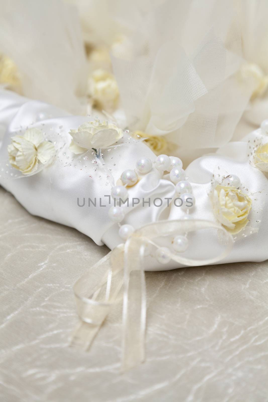 Elegant Wedding Favors decorated with artificial flowers