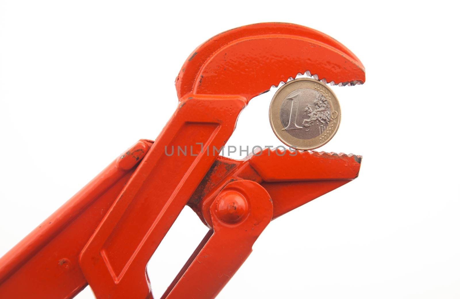 Orange wrench pressing a euro coin by Portokalis