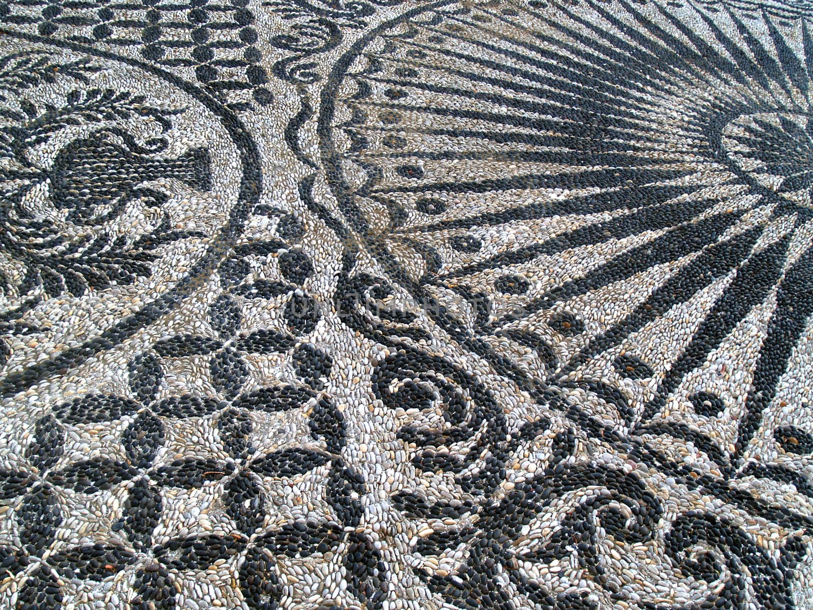 The mosaics with black and white pebbles, which we find to adorn the gardens and interiors of buildings and churches in the Greek islands. Chios island - Greece