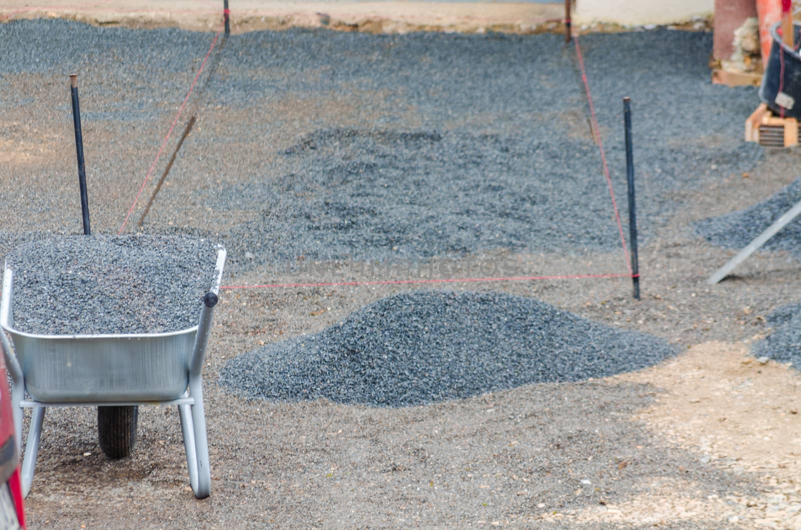 Preparation and production garages driveway with paving stones.