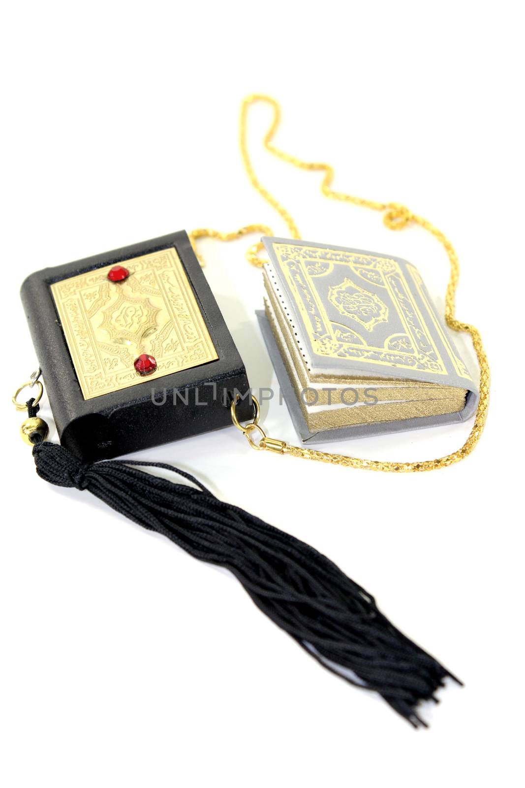 small Quran with Case before light background