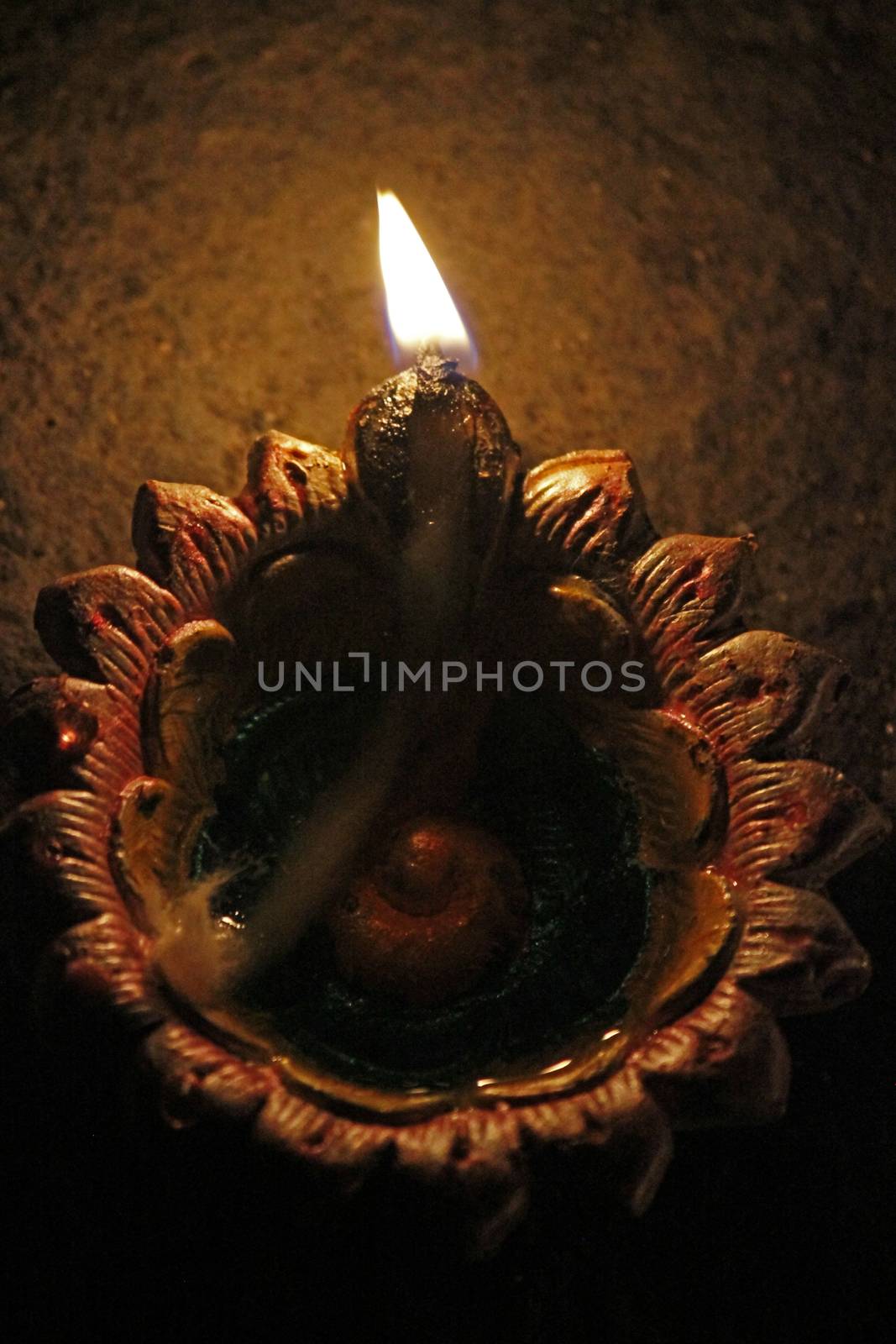 Indian Oil Lamp. An oil lamp is an object used to produce light continuously for a period of time using an oil-based fuel source. The use of oil lamps began thousands of years ago