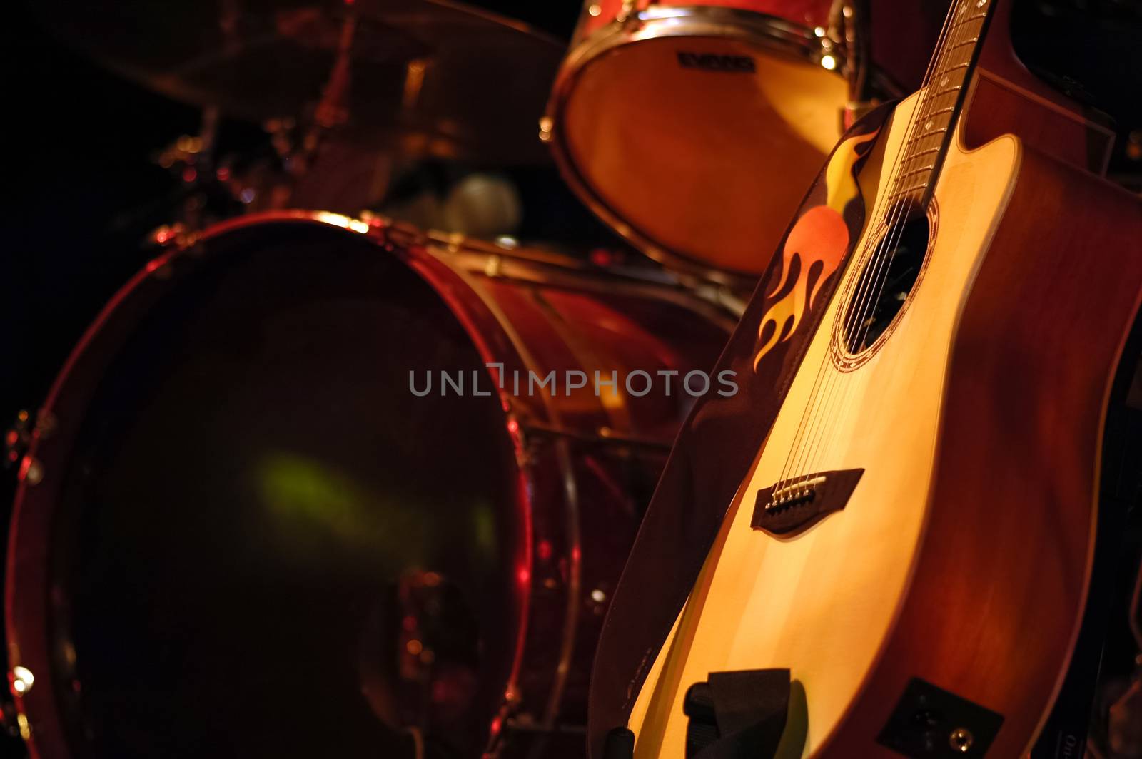 acoustic guitar and drums on stage