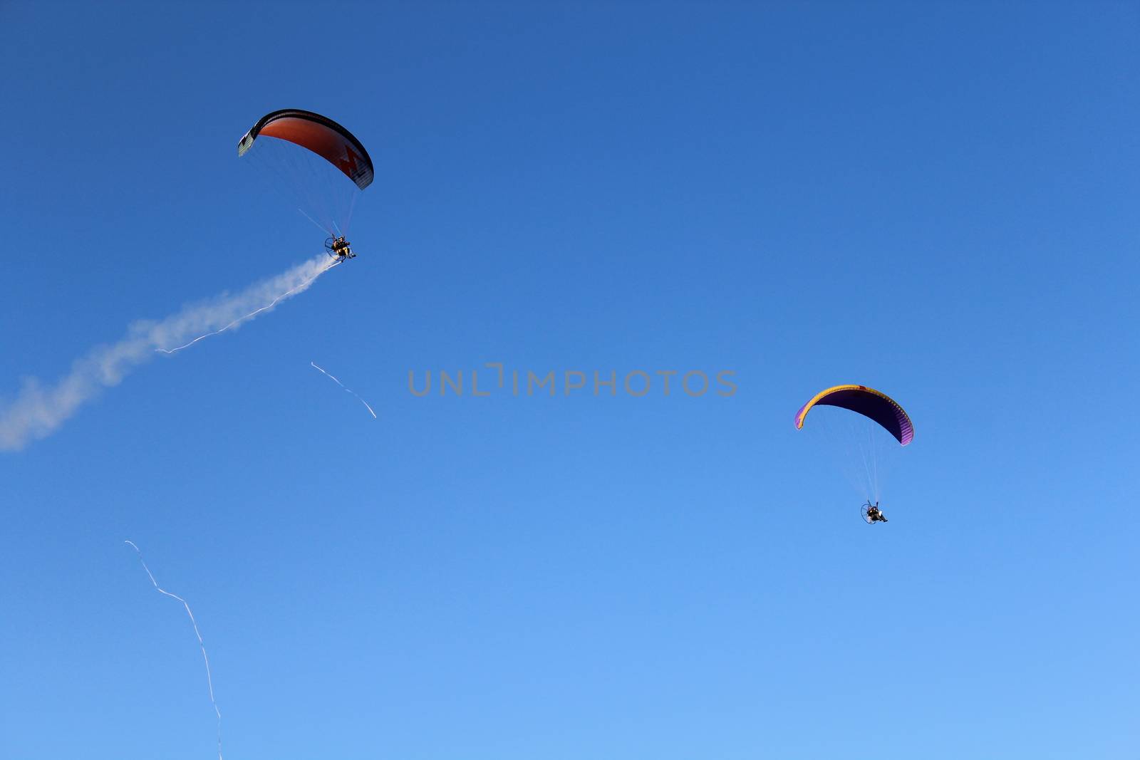 Some pilots, paragliders, make the spectacular perform