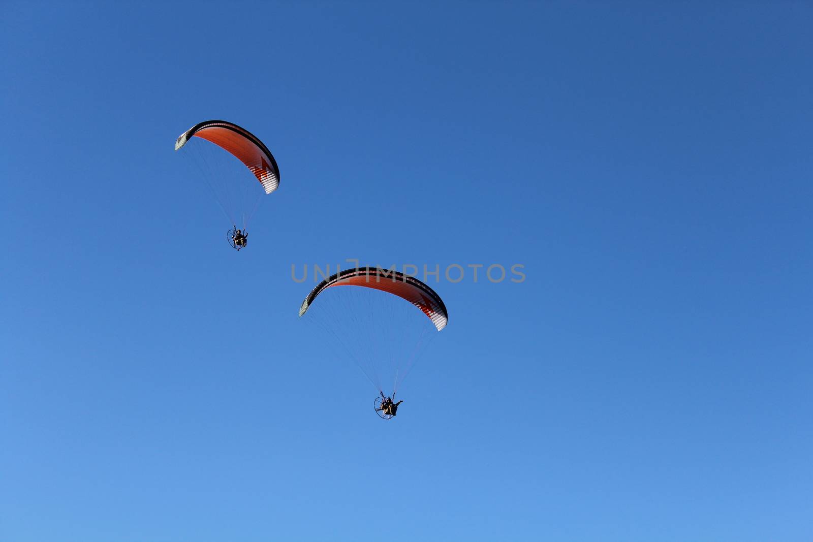 Some pilots, paragliders, make the spectacular perform