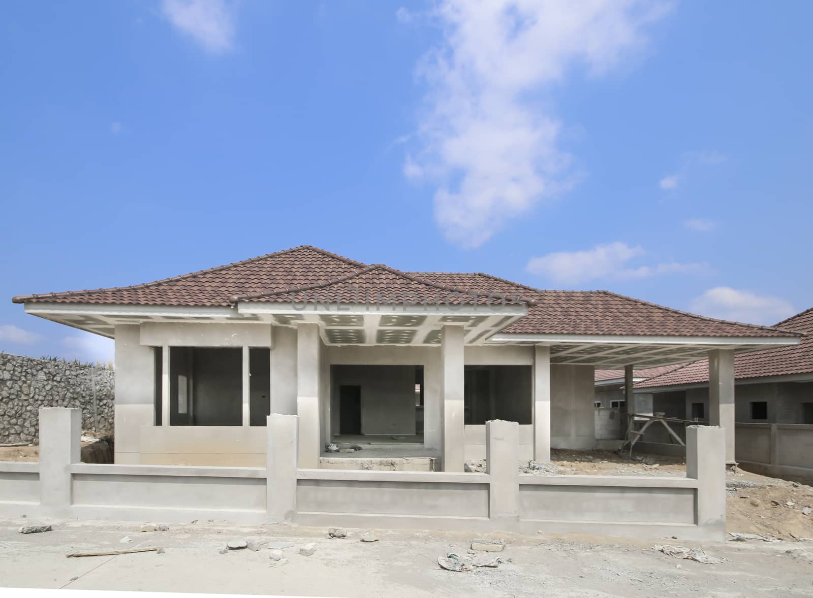 New house under construction with blue sky