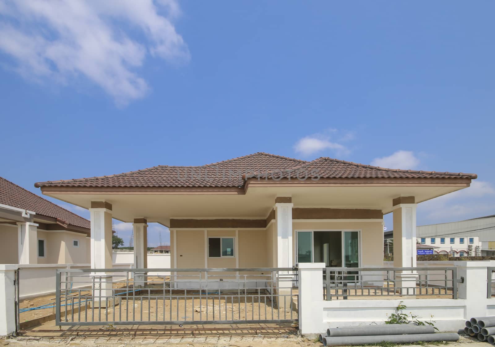 New house under construction with blue sky