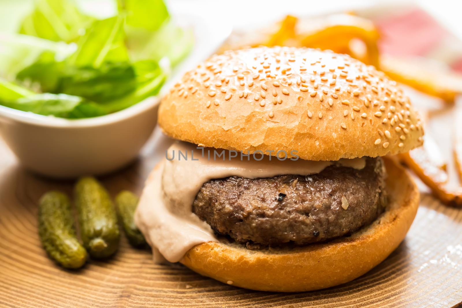 Delicious burger with beef, tomato, lettuce and fries. selective focus