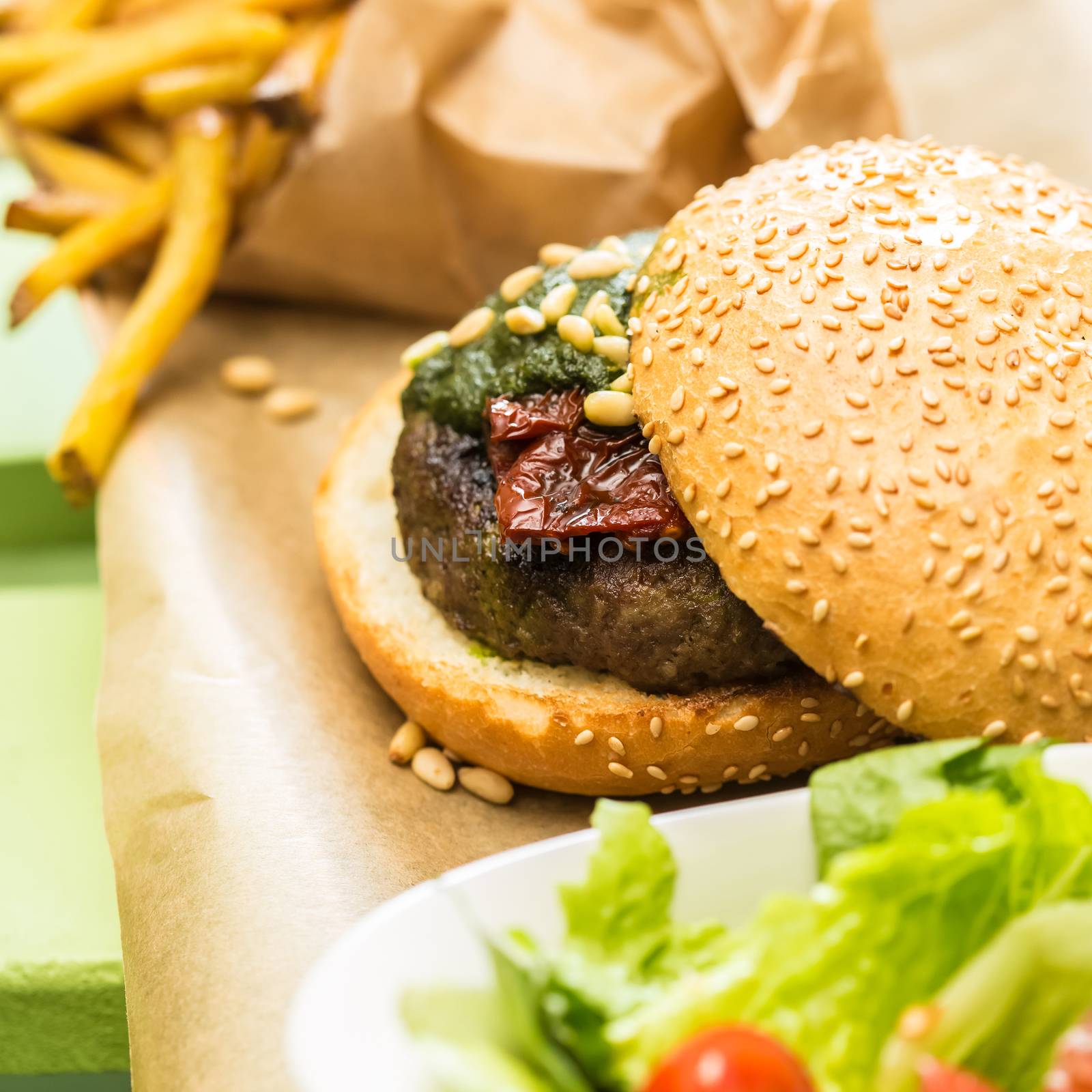 Delicious burger with beef, tomato, lettuce and fries. selective focus