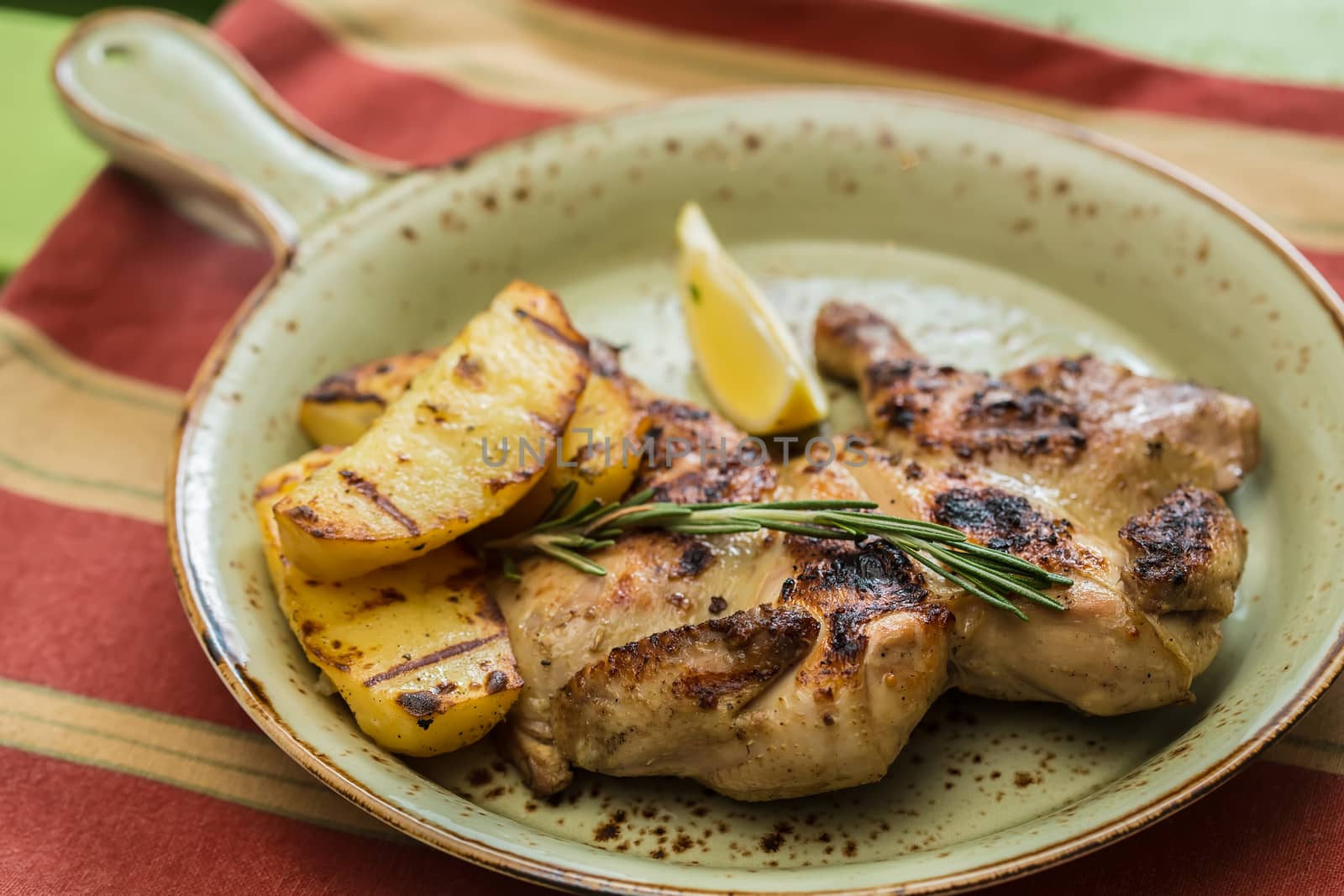 Grilled Chicken Plate in a restaurant. selective Focus