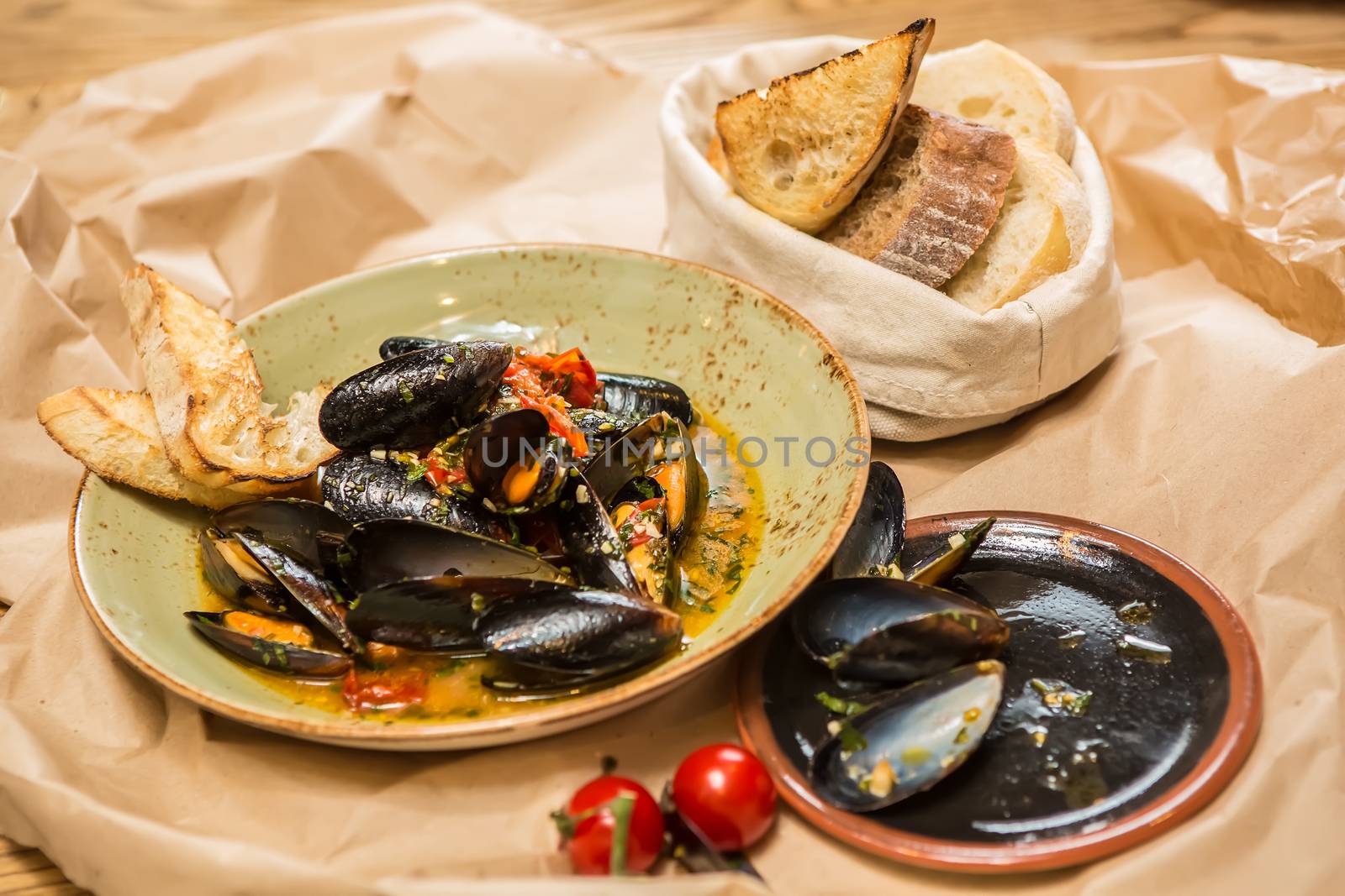 Moules Marinieres. Mussels cooked with white wine sauce. Shallow dof.