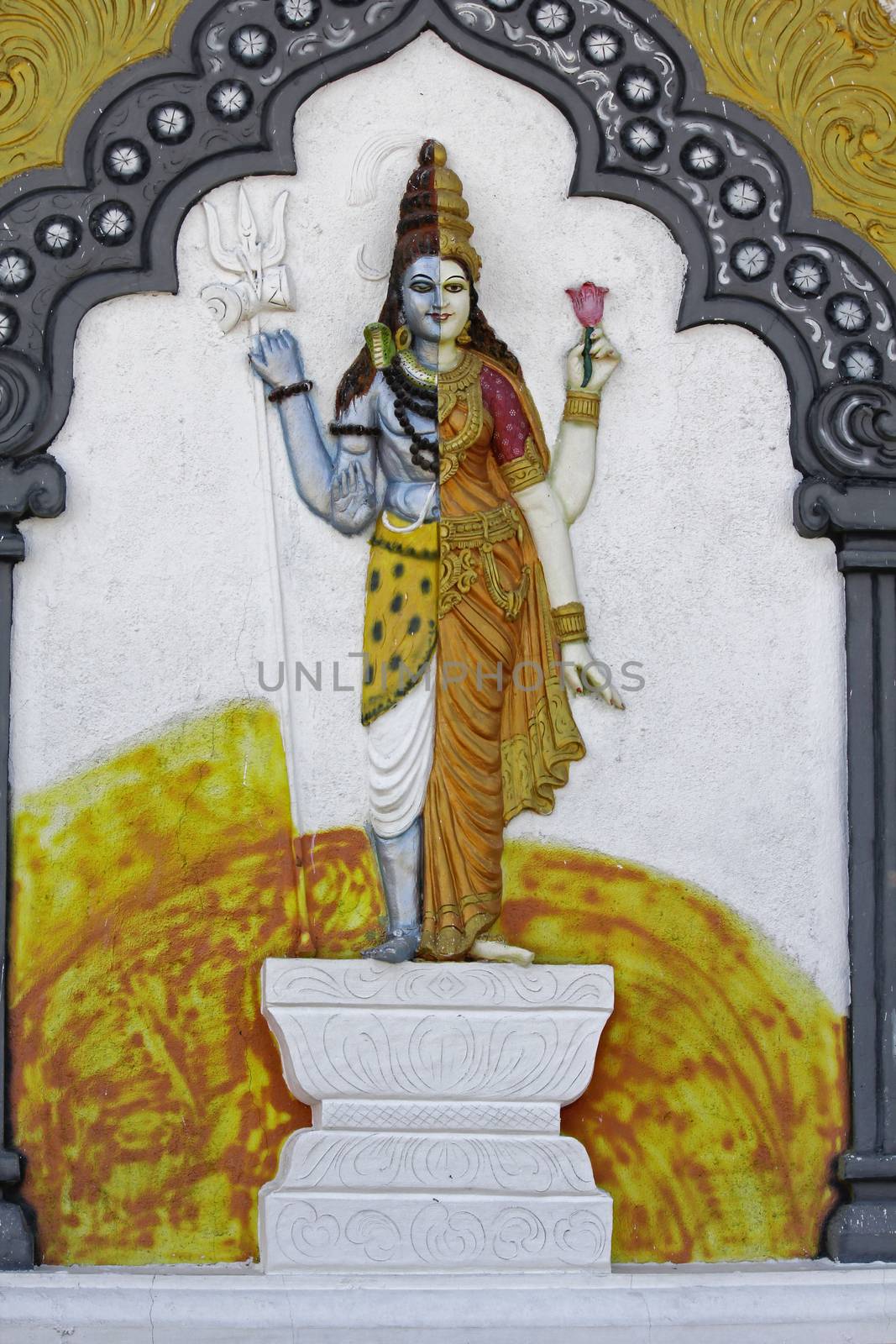 Statue of Ardhanari Nateshwar at Shrinath Mhaskoba Temple, Kodit, Sasvad, Maharashtra, India. Ardhanarishvara is a composite androgynous form of the Hindu god Shiva and his consort Parvati Ardhanarishvara is depicted as half male and half female, split down the middle. The right half is usually the male Shiva, illustrating his traditional attributes.