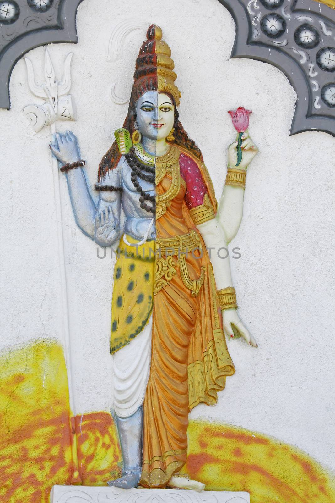 Statue of Ardhanari Nateshwar at Shrinath Mhaskoba Temple, Kodit, Sasvad, Maharashtra, India. Ardhanarishvara is a composite androgynous form of the Hindu god Shiva and his consort Parvati Ardhanarishvara is depicted as half male and half female, split down the middle. The right half is usually the male Shiva, illustrating his traditional attributes.