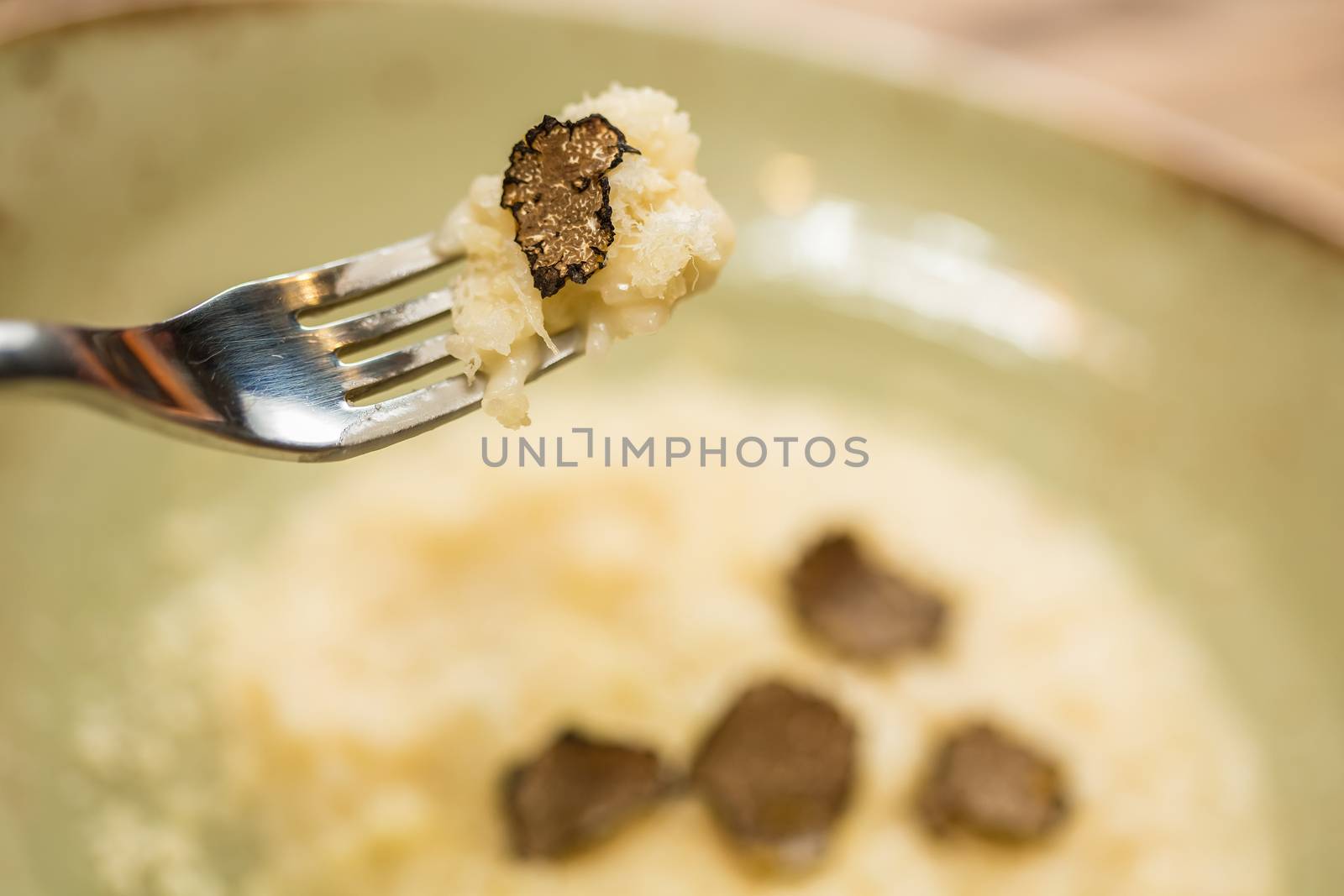 Italian risotto with black truffle. Shallow dof.