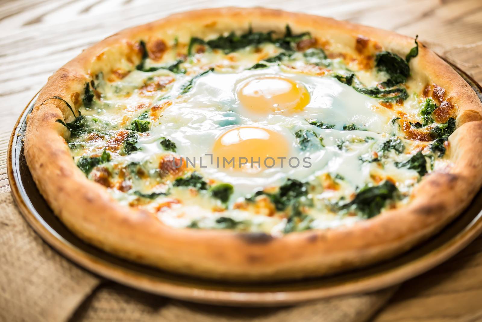 Margarita pizza with arugula and egg by sarymsakov