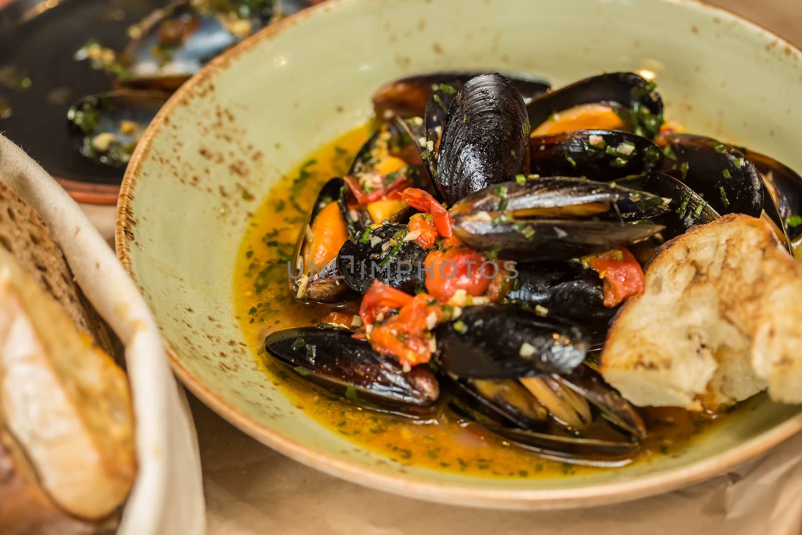 Moules Marinieres. Mussels cooked with white wine sauce. Shallow dof.