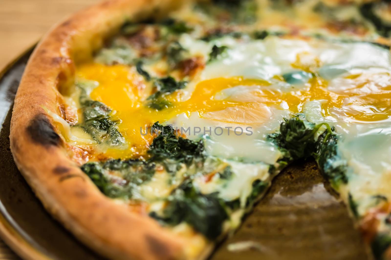 Margarita pizza with arugula and egg for breakfast, selective focus