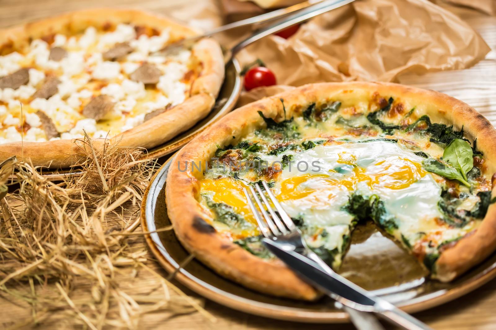 Margarita pizza with arugula and egg for breakfast, selective focus