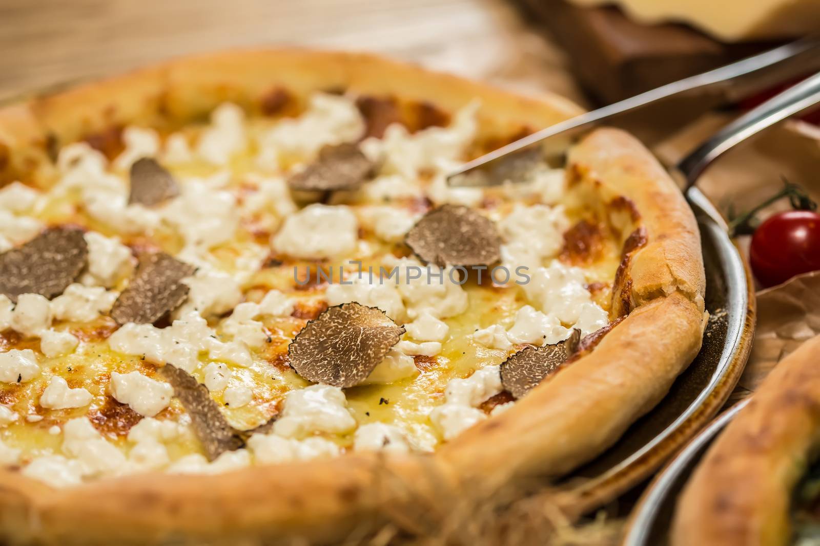 italian pizza with black truffles. Shallow dof.