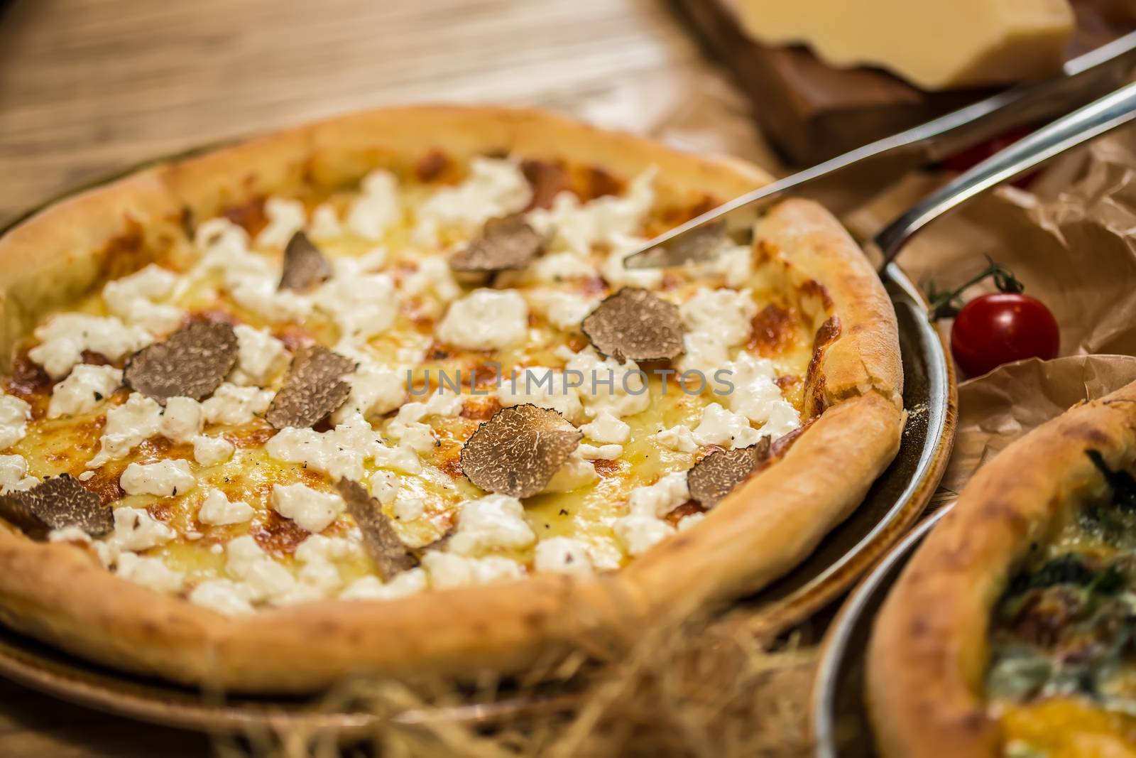 italian pizza with black truffles. Shallow dof.