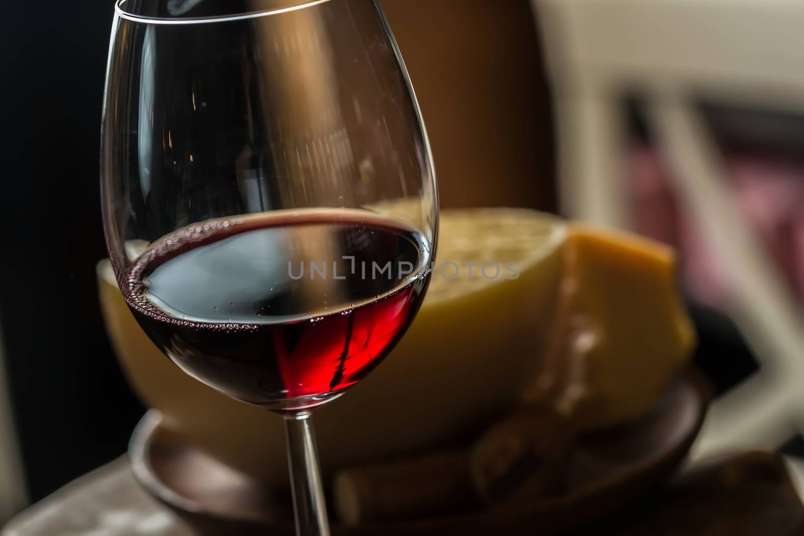 Red wine in glass by sarymsakov