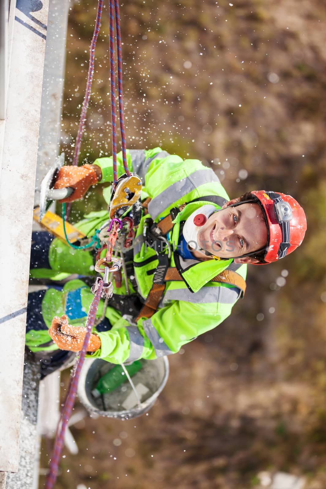 Industrial climber on a building during winterization works
