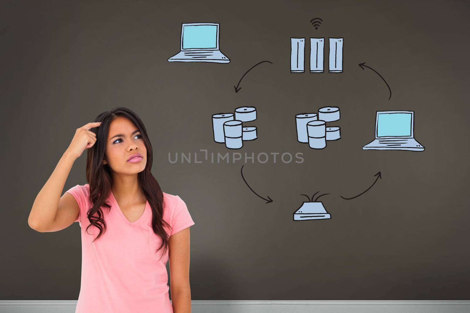 Pretty brunette thinking against room with business technology doodle