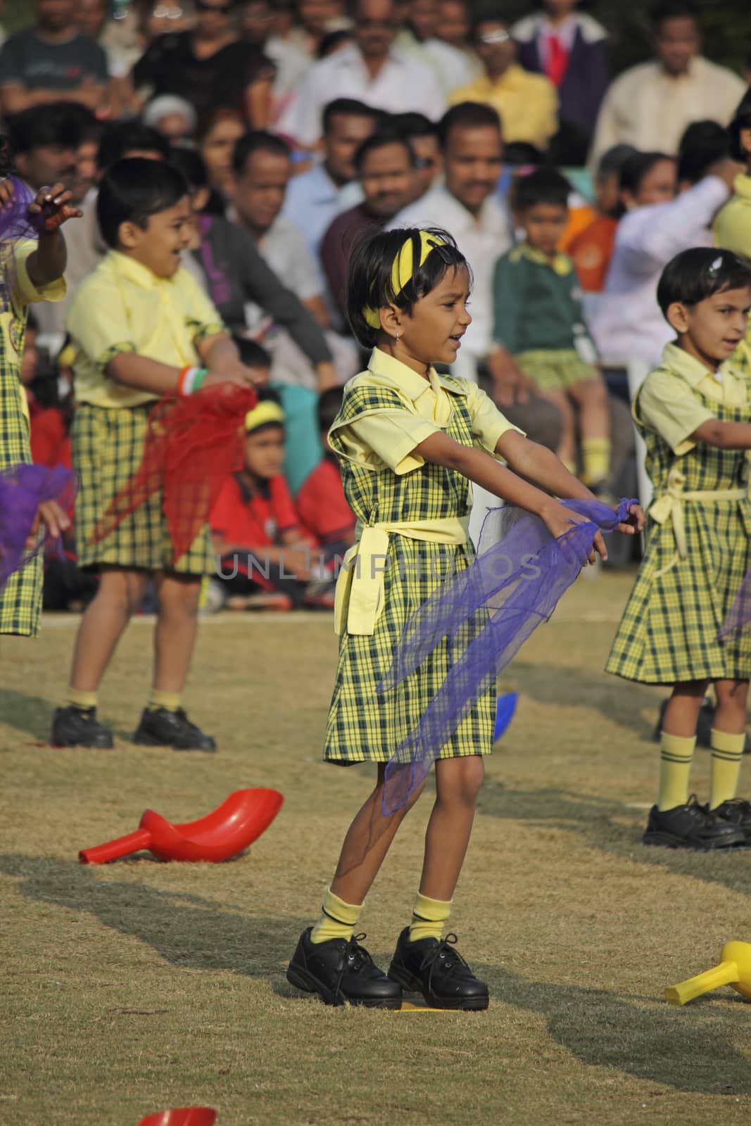 Children dancing with a theme on School Playground