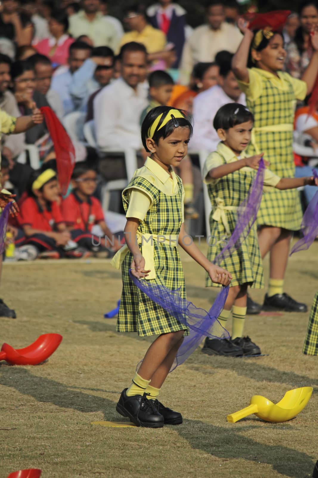 Children dancing with a theme on School Playground